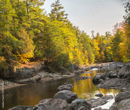 Fototapeta Naklejka Na Ścianę i Meble -  River and fall foliage colors
