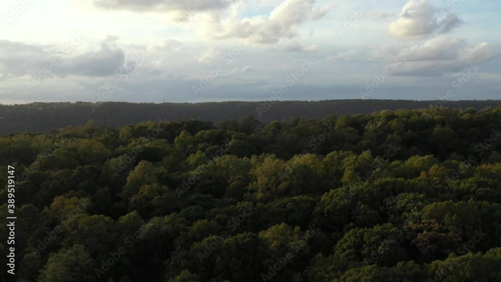 Dramatic aerial ascent over Inwood hill with gorgeous reveal of the Palisades of New Jersey and the Hudson River with dramatic clouds Dramatic aerial ascent over Inwood hill with gorgeous reveal of the Palisades of New Jersey and the Hudson River with dramatic clouds
