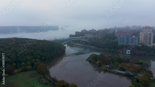 reverse aerial spin near the Henry Hudson Bridge and Spuyten Duyvil during a very foggy morning photo