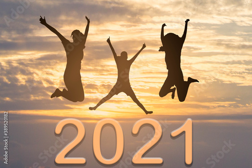 2021 New year concept : Silhouette women jumping on new year 2021