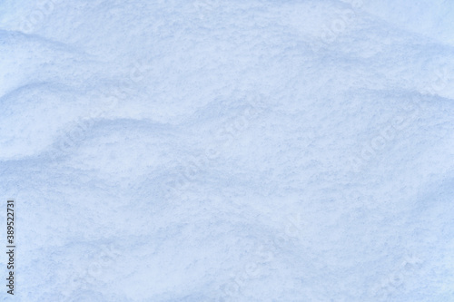 Snow texture. Natural winter background with snow waves