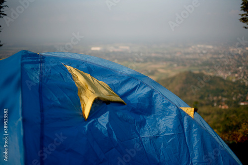 blue tent in the mountains