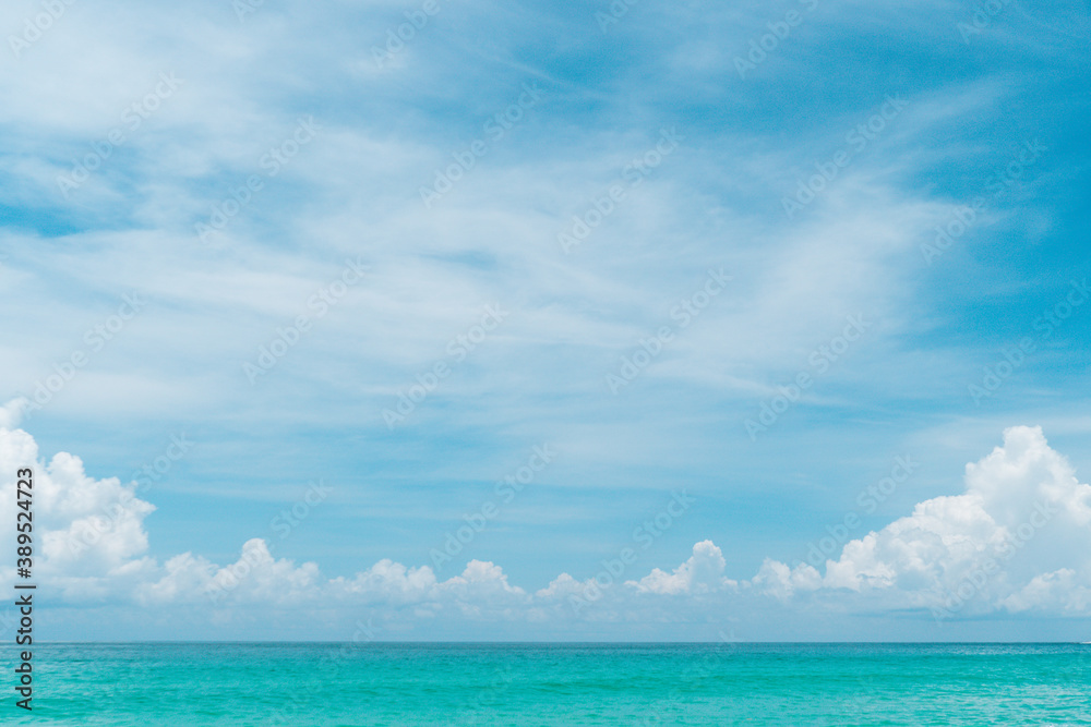 Tropical nature clean beach and white sand in summer with sun light blue sky and bokeh background. Tropical nature clean beach and white sand in summer with sun light blue sky and bokeh background.