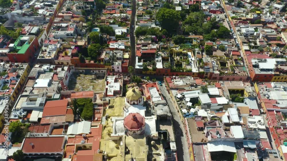 Drone Reveals Historic Catholic Cathedral, Mountain Landscape in San Miguel de Allende. Dolly Backwards, Pan Up Drone Reveals Historic Catholic Cathedral, Mountain Landscape in San Miguel de Allende. Dolly Backwards, Pan Up