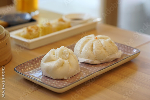 Steamed barbecue pork bun, Chinese dim sum traditional food style. photo