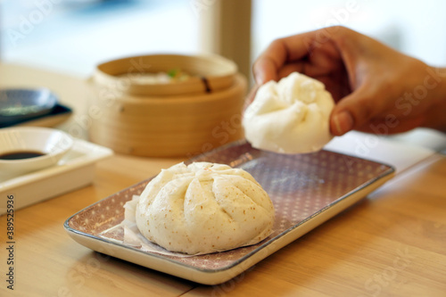 Steamed barbecue pork bun, Chinese dim sum traditional food style. photo