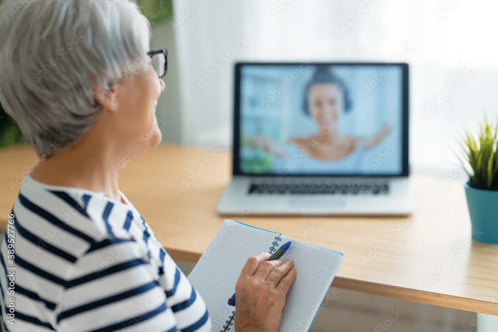 Senior woman is using laptop Senior woman is using laptop