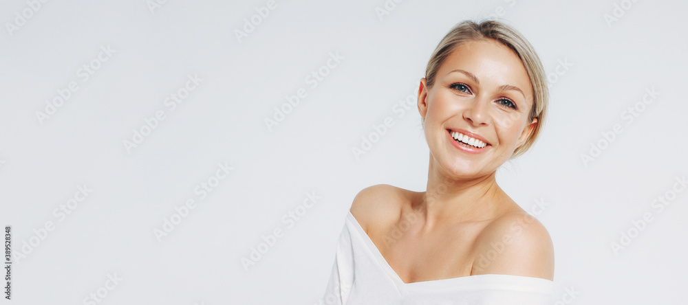 Beauty portrait of blonde smiling laughing woman 35 year plus clean fresh face isolated on white background - obrazy, fototapety, plakaty 