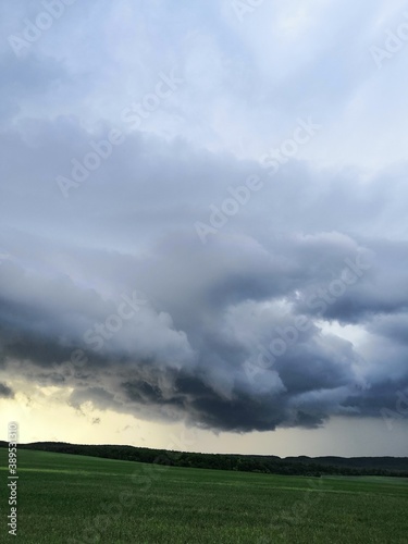 storm clouds over the field © IRINA