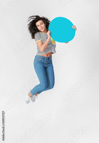 Jumping woman with blank pa...