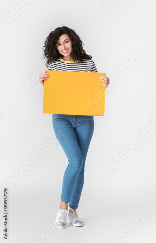 Woman with blank paper shee...