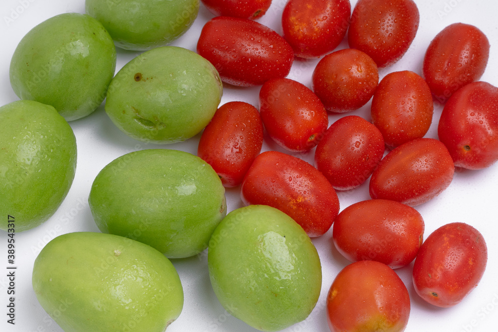 group of green and red cherry tomatoes group of green and red cherry tomatoes
