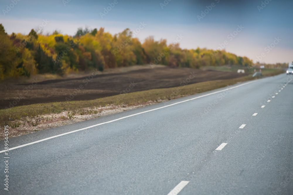 Intercity highway in cloudy autumn. Road. Landscape