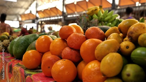fruits and vegetables on a stall in Fort de France Martinique oranges avocados and bananas  photo