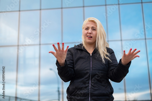 Billede på lærred Emotional deaf and dumb woman talking sign language outdoors.