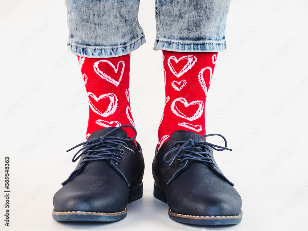 Men's legs, trendy shoes and bright socks. Close-up. Style, beauty and elegance concept Men's legs, trendy shoes and bright socks. Close-up. Style, beauty and elegance concept