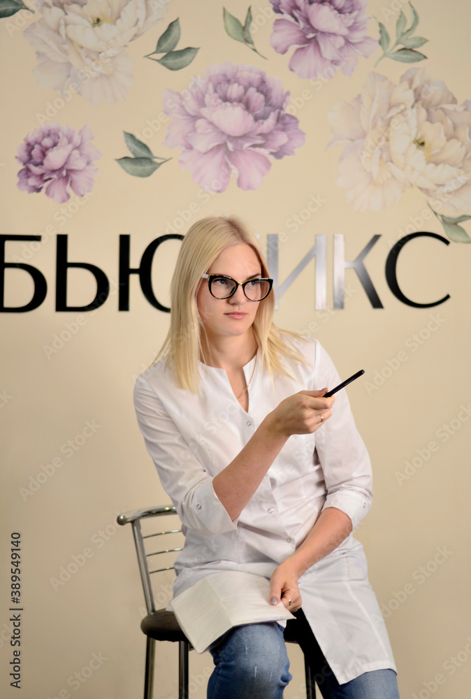 Fototapeta premium beautiful blonde, master beautician in a beauty salon
