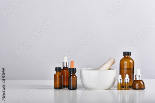 Mortar and pestle with medicine bottles, Alternative medicine in laboratory, Research and development.