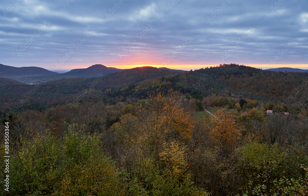 Autumn morning with glowing sunrise at the Palatinate forest in Germany.