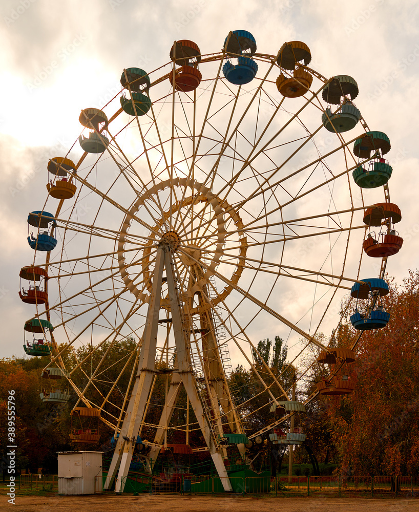 Ferris wheel stands in the autumn park Ferris wheel stands in the autumn park