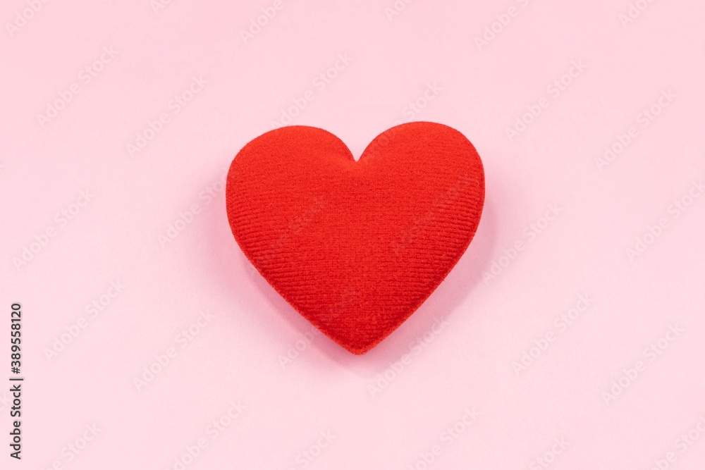red hearth over pink background