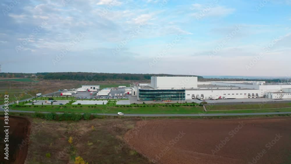 Contemporary farm on nature background. White architecture of industrial plant near the highway. Innovative factory on field. Motion camera to the right. Contemporary farm on nature background. White architecture of industrial plant near the highway. Innovative factory on field. Motion camera to the right.
