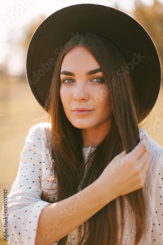 Young beautiful model in a hat on a farm  © photobyalex
