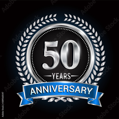 Birthday celebration logo 50th years with wreath, laurel, blue ribbon and silver ring.