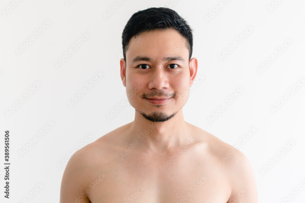 Topless portrait of a happy Asian man on isolated white background.