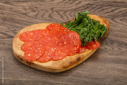 Italian spycy pepperoni sausage slices photo