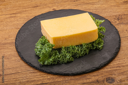 Tasty yelloow Tilsiter cheese brick photo