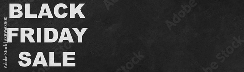 Black friday sale banner on dark concrete background with copy space.