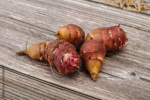 Raw topinambur root or Jerusalem artichoke