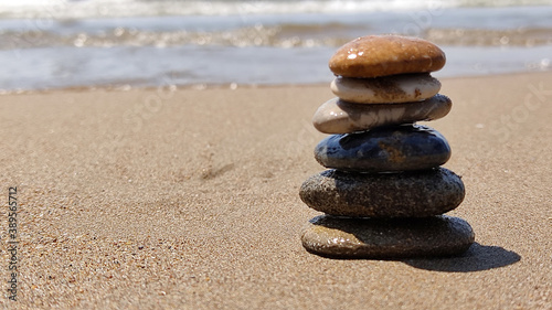 concept of balance sea rocks on sand symbolizing zen