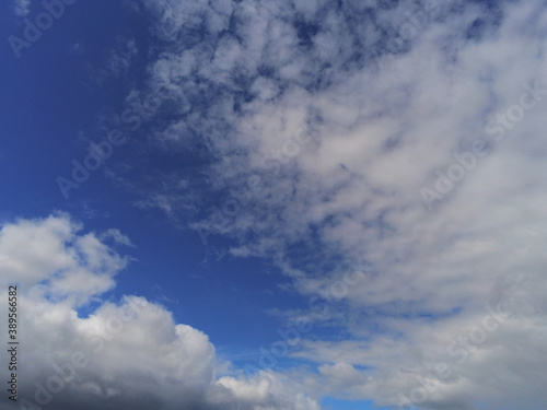 Beautiful white fluffy cloudy sky background 