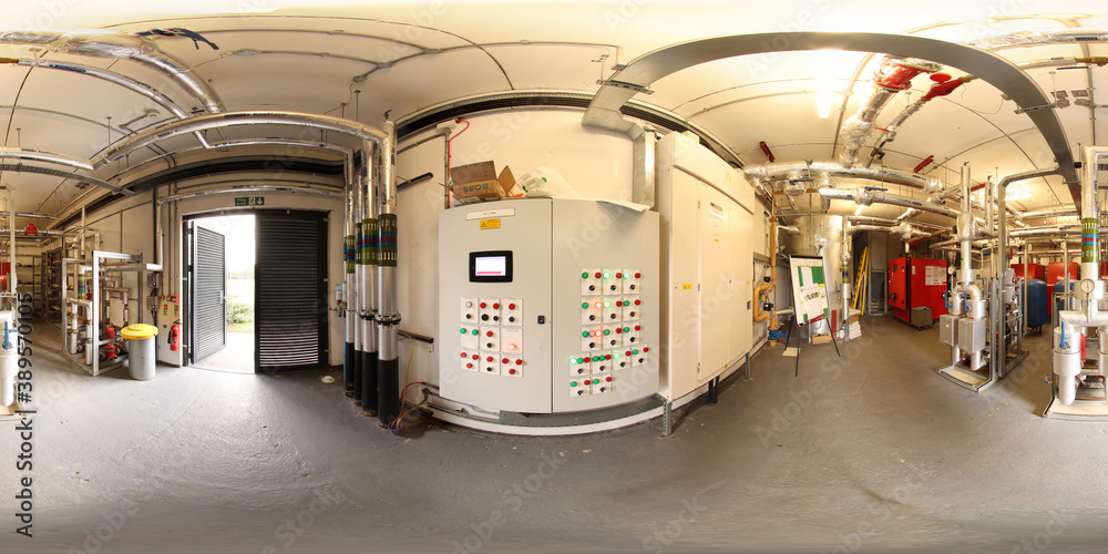 360 Degree full sphere panoramic photo of a modern boiler control room in a basement