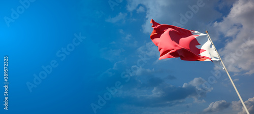 Beautiful national state flag of Bahrain with blank space. Bahrain flag on wide background with place for text 3D artwork.