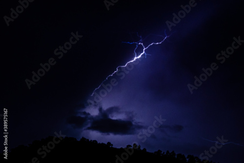 Lightning in a night sky during the thunderstorm