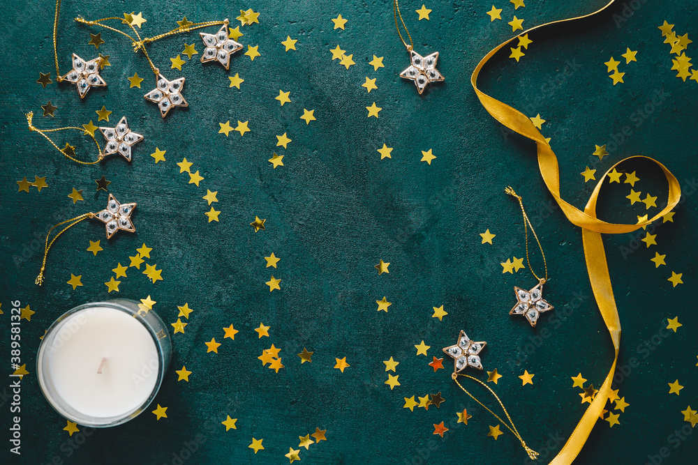 The New Year or Christmas festive flat lay with golden stars over a dark green background. Top view, copy space. - obrazy, fototapety, plakaty 