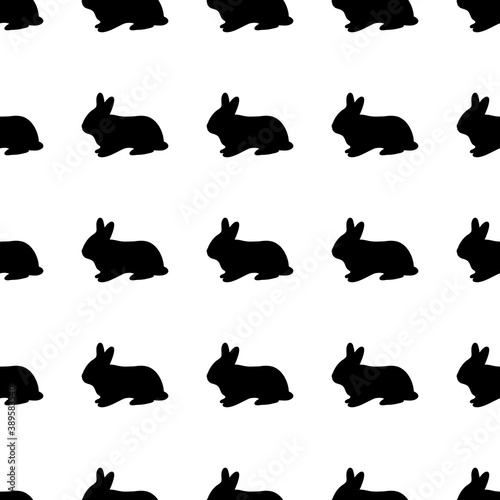 Black silhouette of a rabbit on a white background. Vector illustration. Seamless pattern.