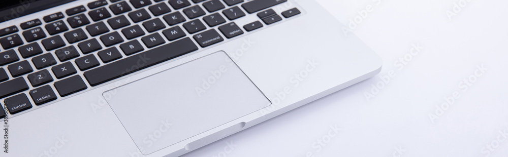 new modern laptop keyboard with enew modern laptop keyboard with earphones isolated on white background, close view arphones isolated on white background, close view . High quality photo new modern laptop keyboard with enew modern laptop keyboard with earphones isolated on white background, close view arphones isolated on white background, close view . High quality photo