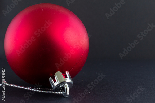 Christmas decoration red ball with black background. Christmas balls.