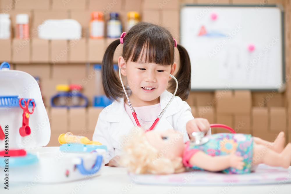 Fototapeta premium young girl pretend play doctor role at home