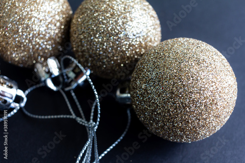 Christmas decoration yellow gold balls with black background. Christmas balls.