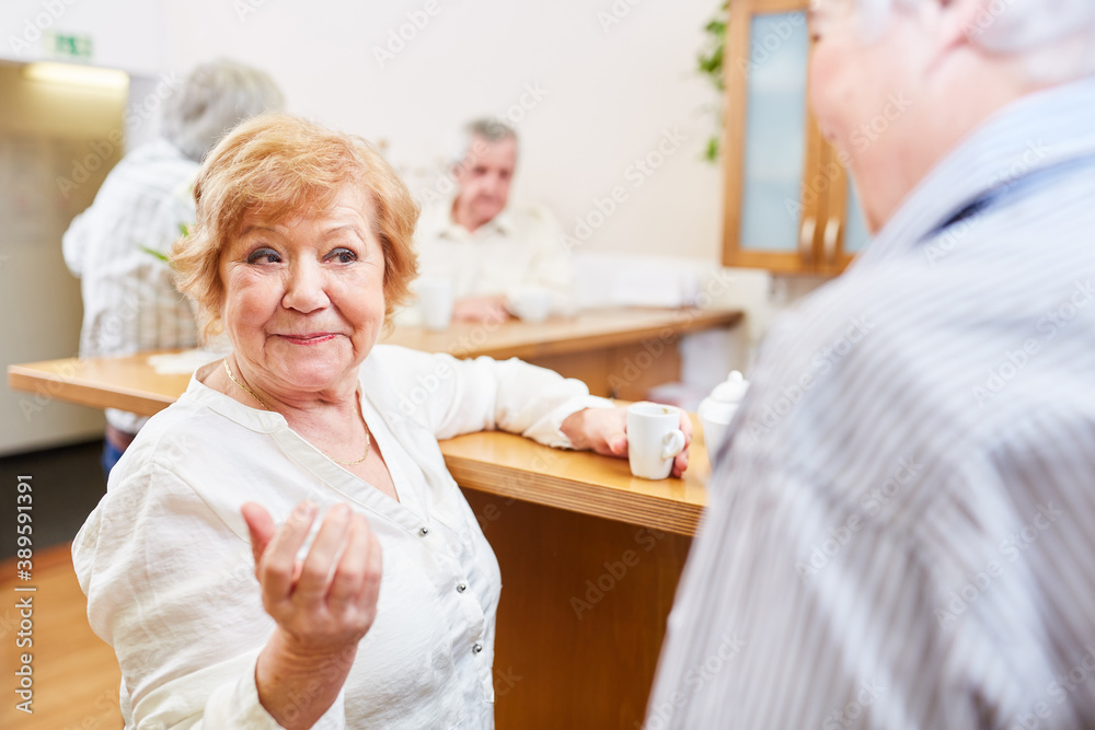 Two seniors talk and flirt with each other Two seniors talk and flirt with each other