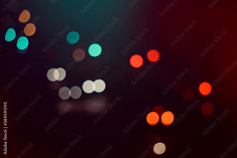 multi colored lights on the street in the city at night, bokeh lights