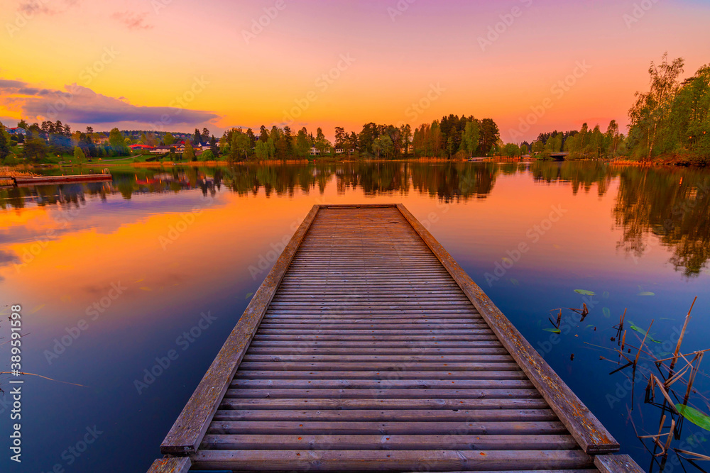 Jetty at beautiful sunset lake