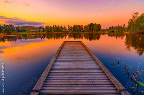 Jetty at beautiful sunset lake © Katrine