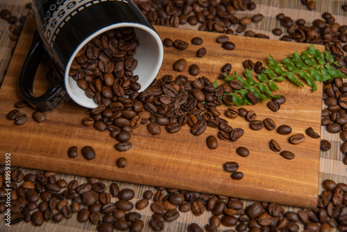 roasted coffee beans and a cup of coffee