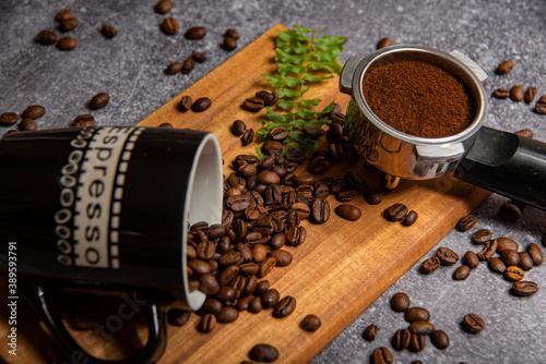 roasted coffee beans and a cup of coffee